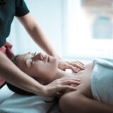selective focus photo of woman getting a massage